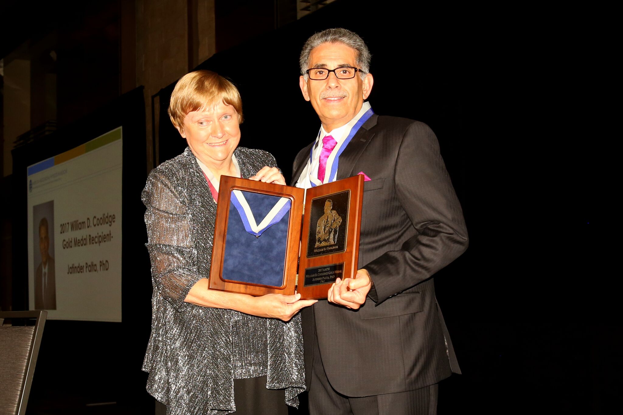 Dr. Palta Accepting the award from President Melissa Martin