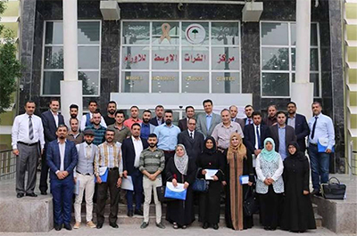 Figure 3: Conference attendees at the entrance of the Middle Euphrates Cancer Centre (MECC)