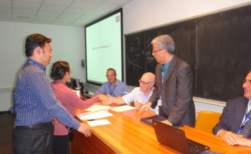 Receiving the best poster presentation award at the 2014 CMP, ICTP in Trieste, Italy.